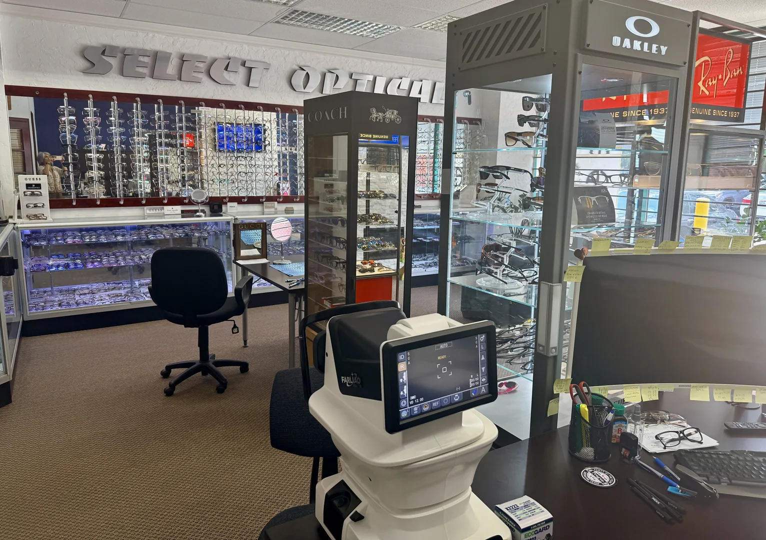 Inside Select Optical Inc in Mississauga — unhurried consultation area and designer eyewear displays where Dr. Roxanna Gangi performs eye exams, contact lens fittings, and OHIP-covered visits for patients across Peel Region.
