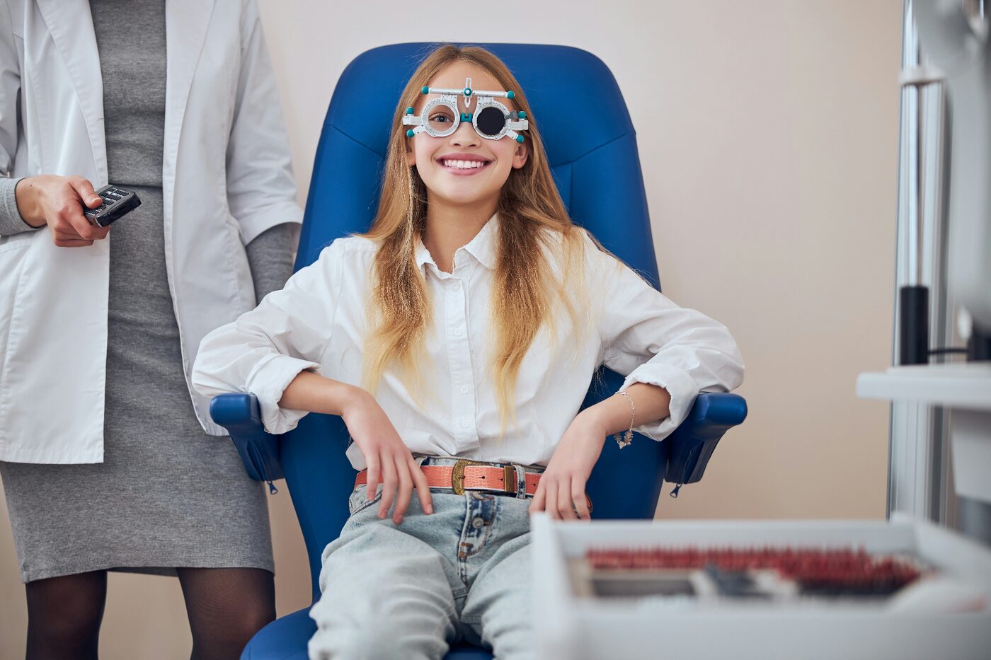 Young patient receiving a trial frame refraction during an eye exam with Dr. Roxanna Gangi, Optometrist in York Region
