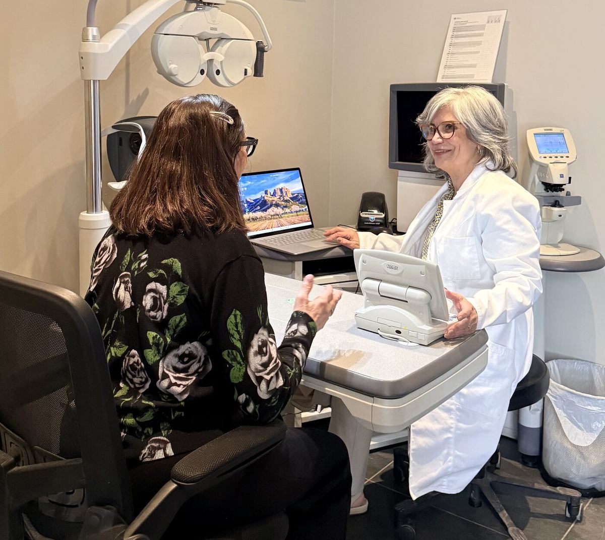 Dr. Roxanna Gangi, Optometrist, performing a comprehensive eye exam with phoropter and autorefractor at Pro Eye Exam in York Region — refraction, eye health assessment, and patient consultation